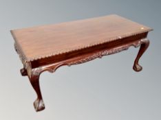 An antique style mahogany coffee table,