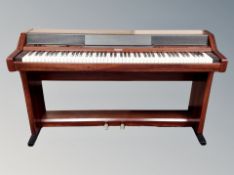 A Roland piano plus 450 electric keyboard,