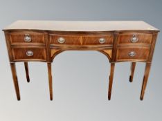 An inlaid mahogany serpentine fronted sideboard,