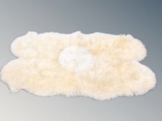 A sheepskin rug,
