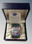 A Moorcroft enamelled pill box in fitted case