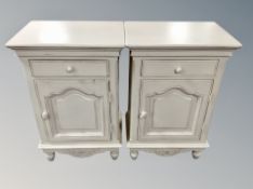A pair of painted pine bedside cabinets, each width 48 cm.