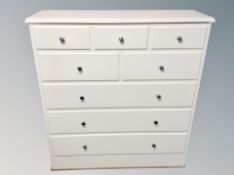 A contemporary white cabinet with simulated drawers,