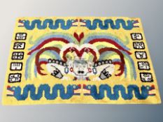 A Chinese woolen rug on yellow ground 174 cm x 116 cm