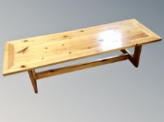 A pine long low coffee table,