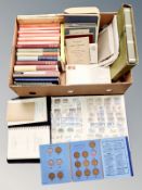 A box of books relating to stamps,