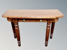 A contemporary stained pine side table,