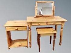 A pine contemporary dressing table with two drawers with stool together with bedside stand and