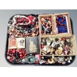 A collection of costume jewellery, brooches, necklaces, two coral necklaces,