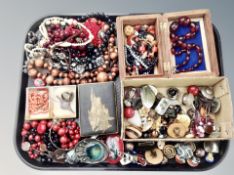 A collection of costume jewellery, brooches, necklaces, two coral necklaces,