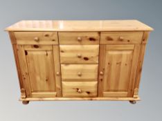 A pine sideboard fitted with four drawers width 130 cm