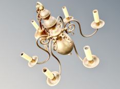 A brass six branch light fitting,