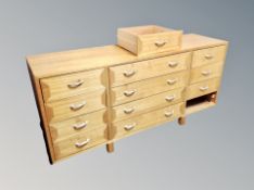 A light beech multi drawer low sideboard,