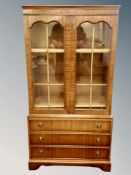 A reproduction mahogany bookcase with 79 cm