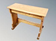 An Edwardian oak organ stool width 76 cm