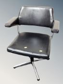 A 20th century black vinyl swivel office chair