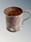 A silver mug, Birmingham marks, height 6.5 cm CONDITION REPORT: 100.