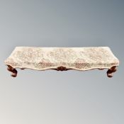 A rectangular long footstool in tapestry fabric together with a further footstool
