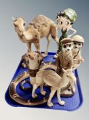 A resin figure of a cobra, cast resin camel, figure of Betty Boop,