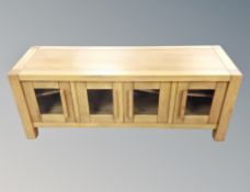 A contemporary hardwood entertainment stand,
