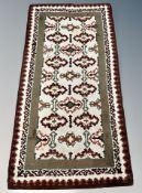 A 1960's wool rug 183 cm x 94 cm