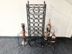 A wrought metal wine rack, similar candle holder,