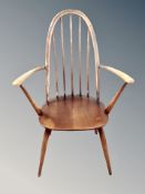 An Ercol elm armchair