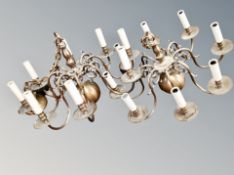 A pair of brass eight branch chandeliers