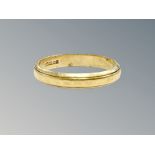 An 18ct gold band ring, size N CONDITION REPORT: 2.