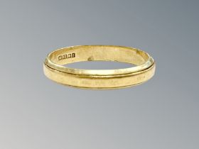 An 18ct gold band ring, size N CONDITION REPORT: 2.