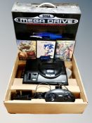 A Sega Mega Drive in original box including Desert Strike,
