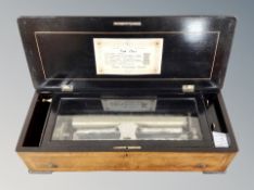 A 19th century walnut, ebonised and satinwood strung Swiss cylinder music box,