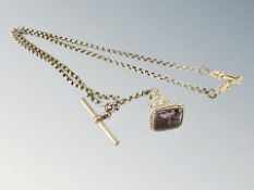 A gold plated watch Albert chain with carved intaglio amethyst-coloured seal