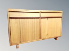 A teak double door low sideboard,