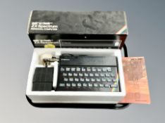 A Sinclair ZX Spectrum in original box with instructions.