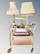 A gilt trolley, three table lamps, box of artist's paint,