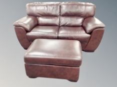 A pair of two seater brown leather settees with matching footstool, each width 175 cm.