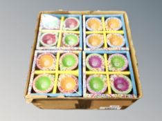 A box of 24 Diwali traditional oil lamps, in packs of four.
