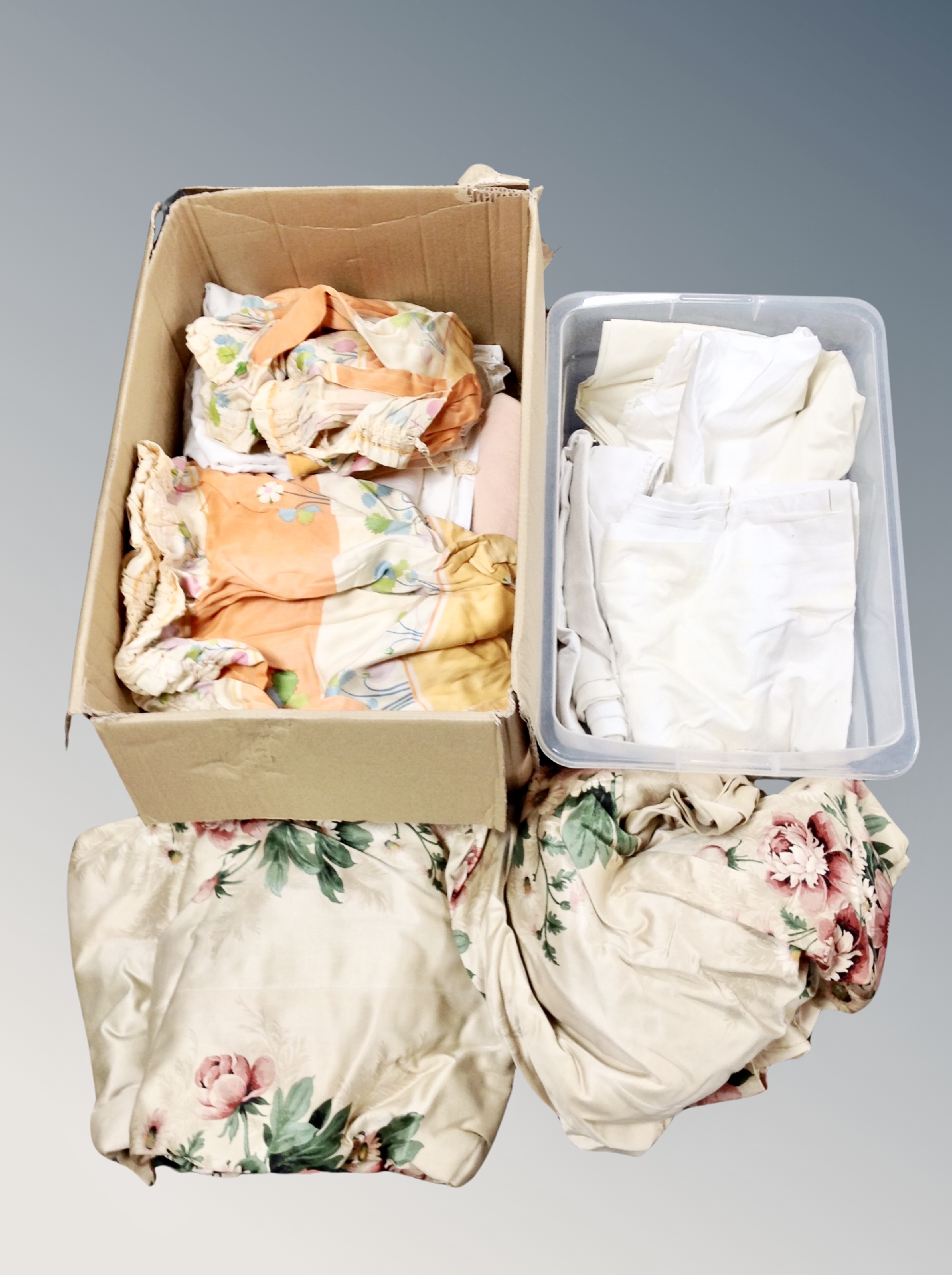 Two boxes of curtains and linen