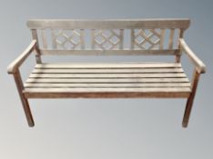 A 20th century teak garden bench,
