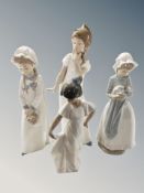 Four Nao figures of girls in night dress