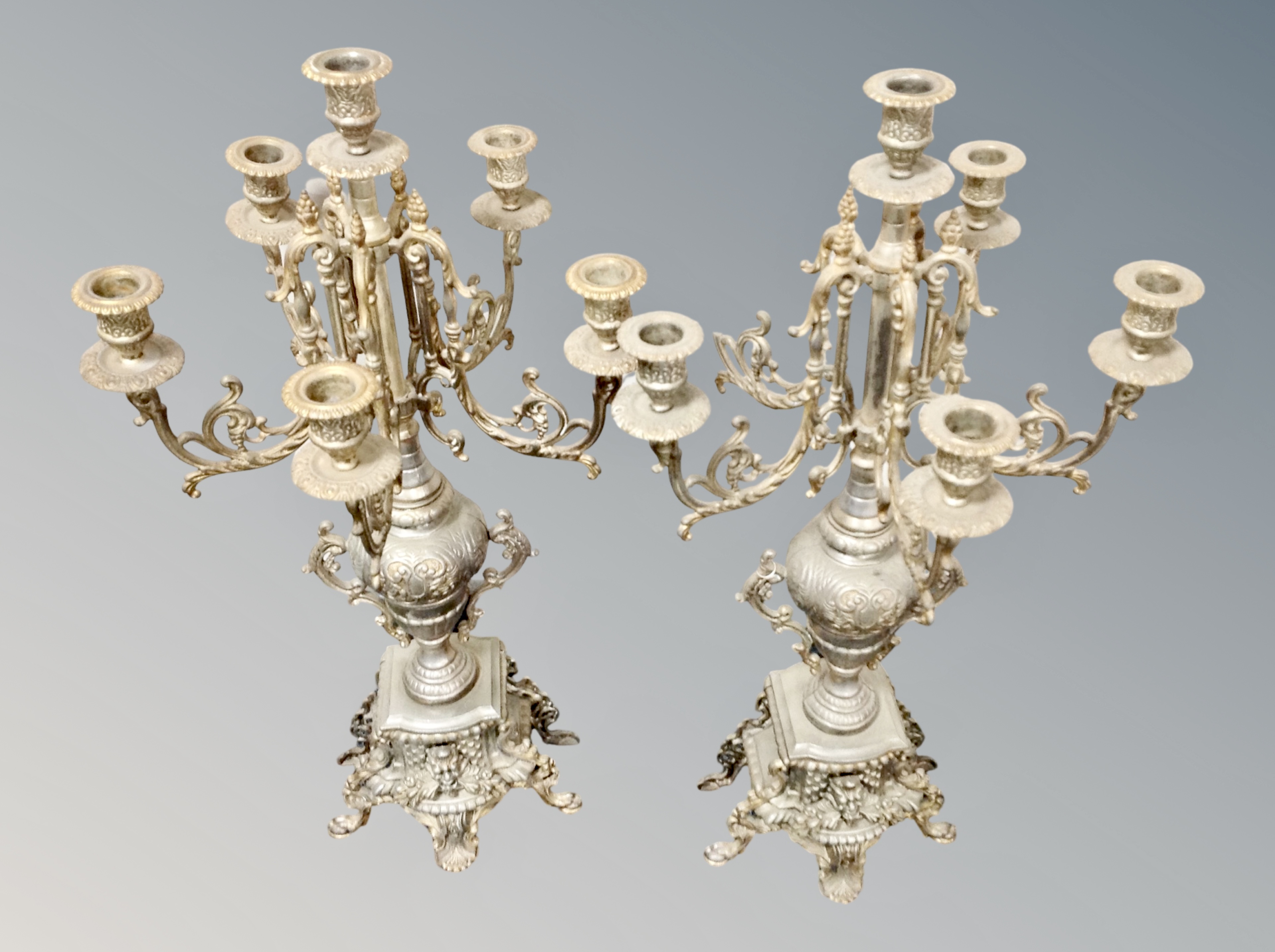 A pair of ornate gilt metal candelabra,