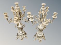 A pair of ornate gilt metal candelabra,