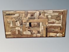 A carved wooden panel 126 cm x 57 cm