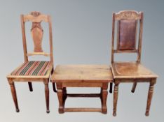 A pair of continental oak chairs together with a solid oak low table with 63 cm
