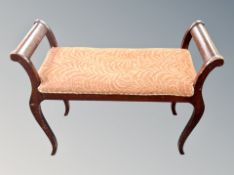 An early 20th century beech piano stool width 77 cm