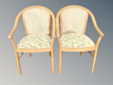 A pair of cane backed beech armchairs