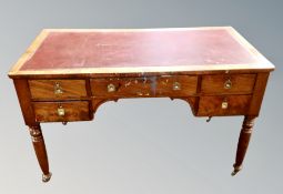 A Victorian mahogany desk fitted with five drawers,
