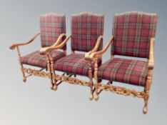 Three reproduction carved armchairs in tartan upholstery