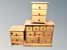 A pair of pine three drawer chests width 46 cm each,